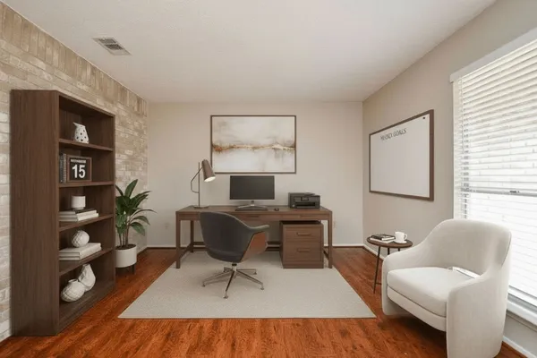 a workspace with furniture and wooden floor