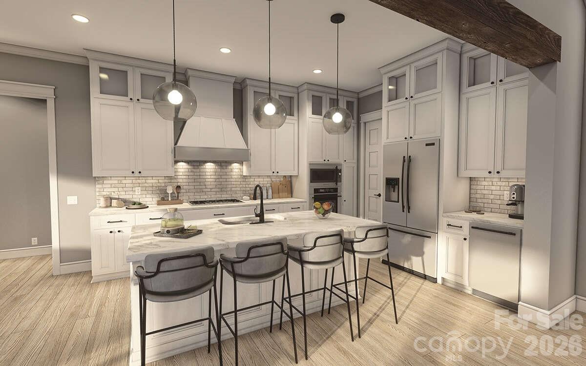 0 Trinity Court Salisbury, NC 28147 - Photo 21 of 38 a kitchen with stainless steel appliances kitchen island a table and chairs in it