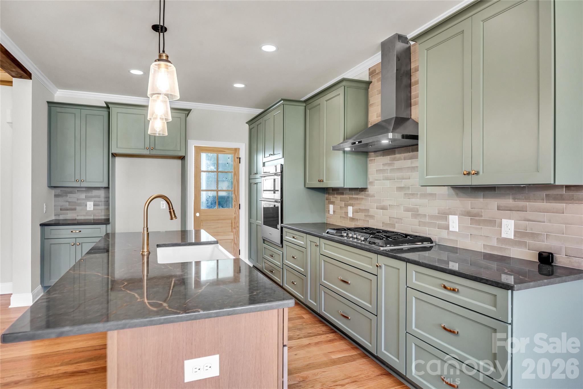 0 Trinity Court Salisbury, NC 28147 - Photo 5 of 38 a kitchen with stainless steel appliances granite countertop a stove a sink and a white cabinets