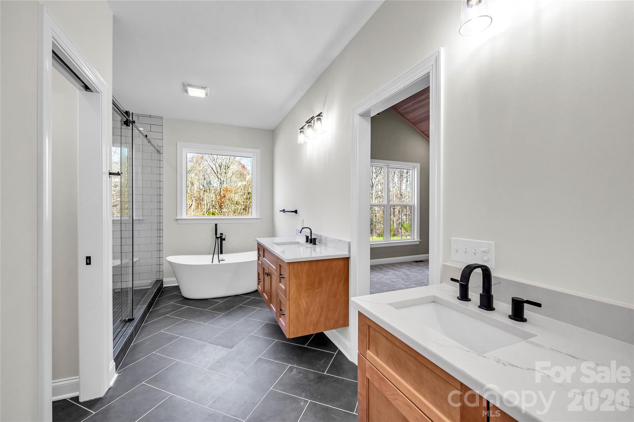 0 Trinity Court Salisbury, NC 28147 - Photo 6 of 38 a large spacious bathroom with a double vanity sink a mirror and a bathtub