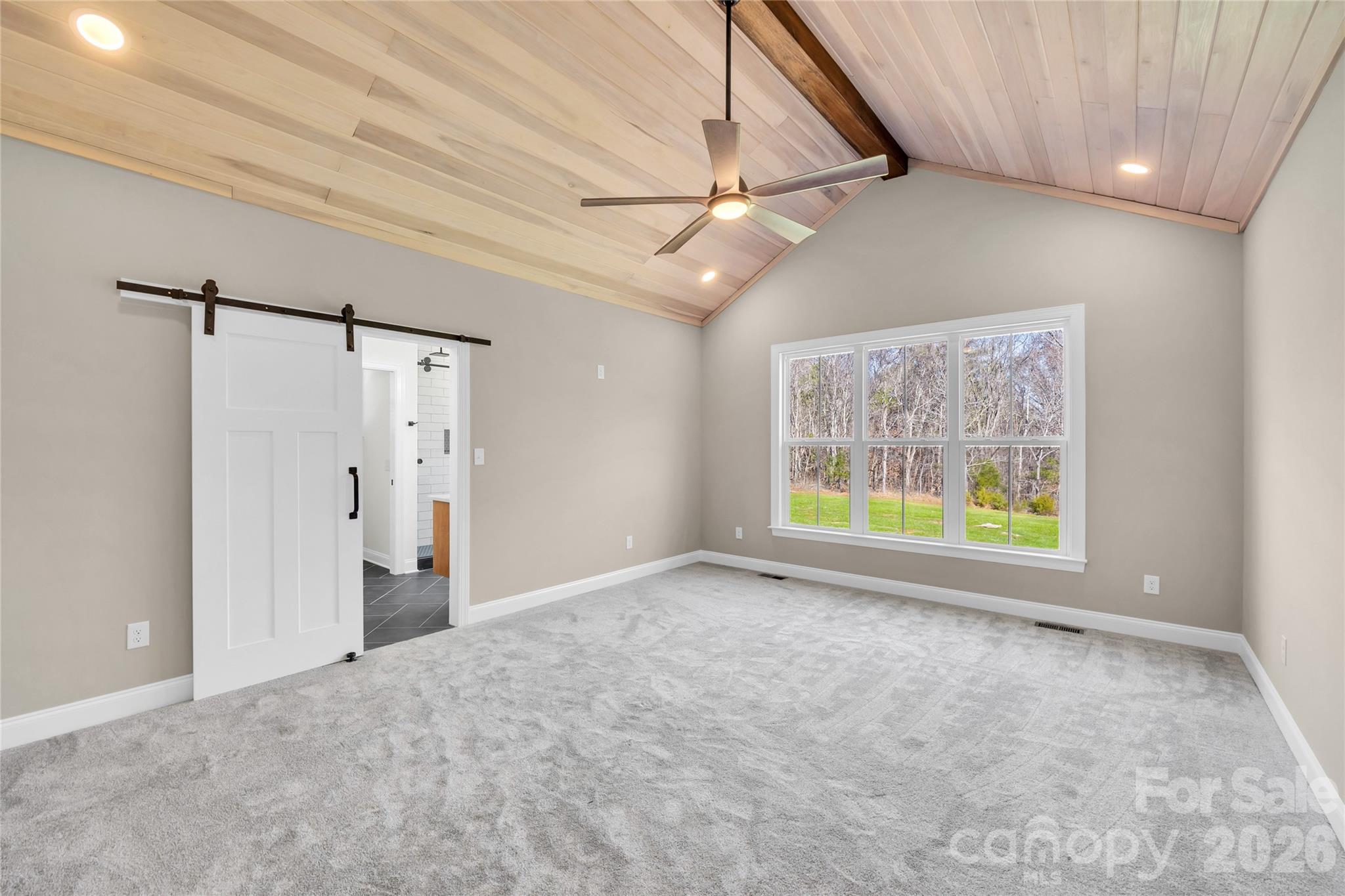 0 Trinity Court Salisbury, NC 28147 - Photo 7 of 38 en empty room with windows and ceiling fan