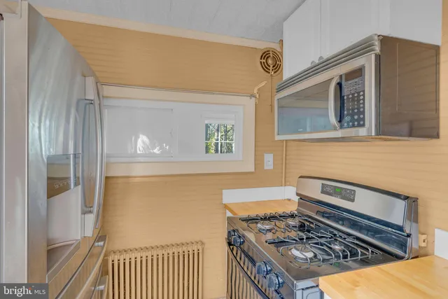 a kitchen with a stove and a cabinet
