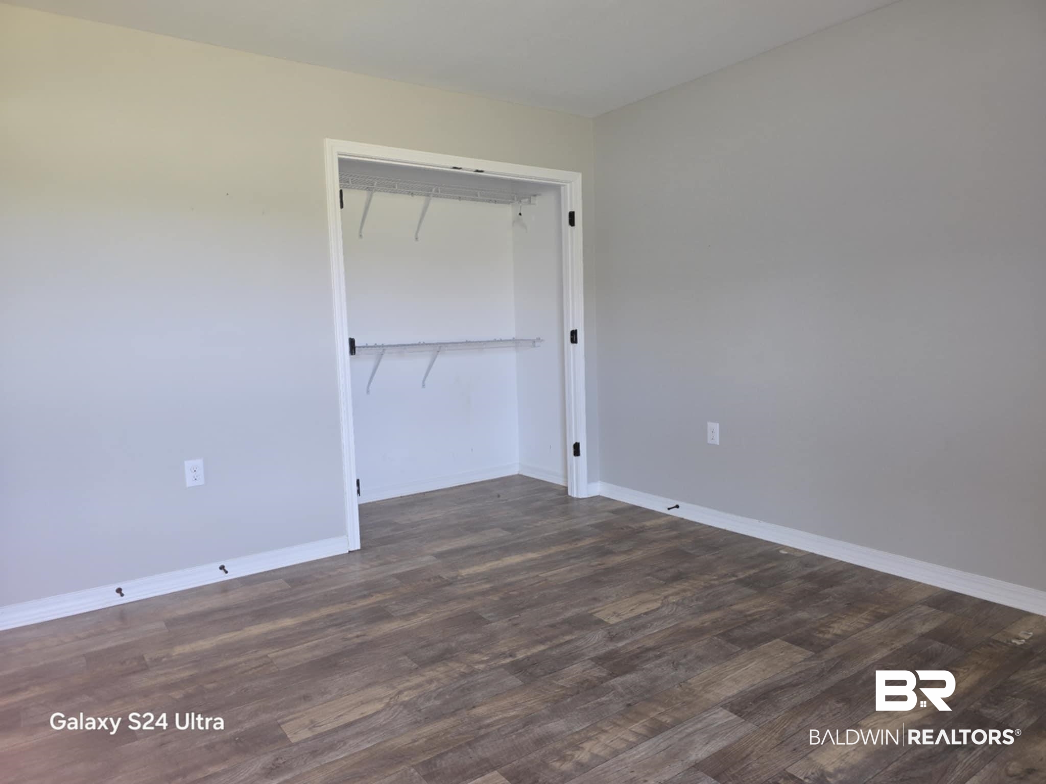 546 Wolf Log Road Flomaton, AL 36441 - Photo 10 of 15 Spare room featuring hardwood / wood-style floors