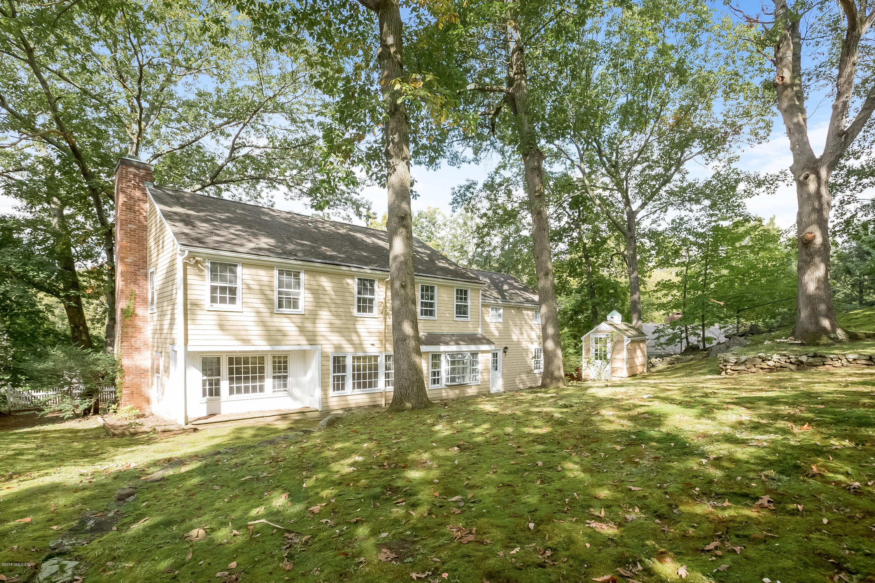 8 Skylark Road Greenwich, CT 06830 - Photo 11 of 15 a large tree in front of a house
