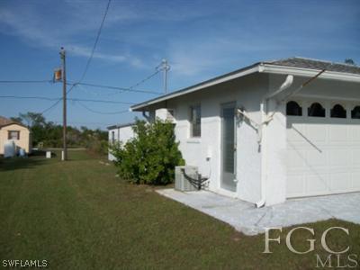 26450 Brooks Road Punta Gorda, FL 33955 - Photo 2 of 9 a front view of a house with a yard