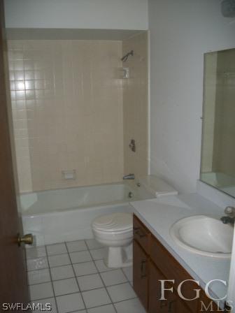 26450 Brooks Road Punta Gorda, FL 33955 - Photo 6 of 9 a bathroom with a granite countertop sink a toilet and bathtub