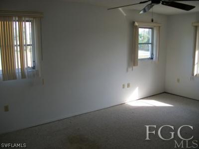 26450 Brooks Road Punta Gorda, FL 33955 - Photo 8 of 9 a view of empty room with windows