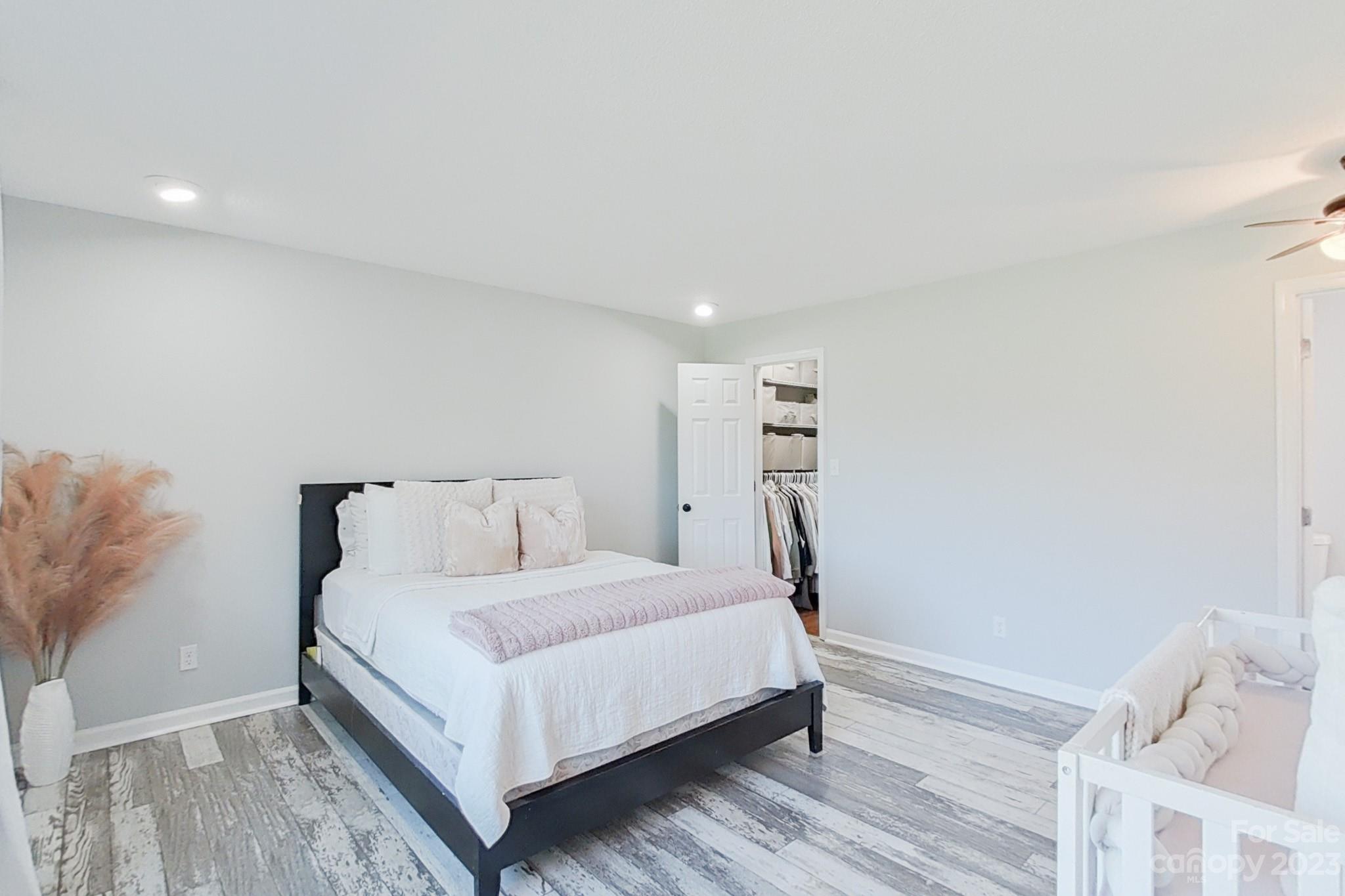 8176 Renee Ford Road Stanfield, NC 28163 - Photo 26 of 48 a large white bed in a white room