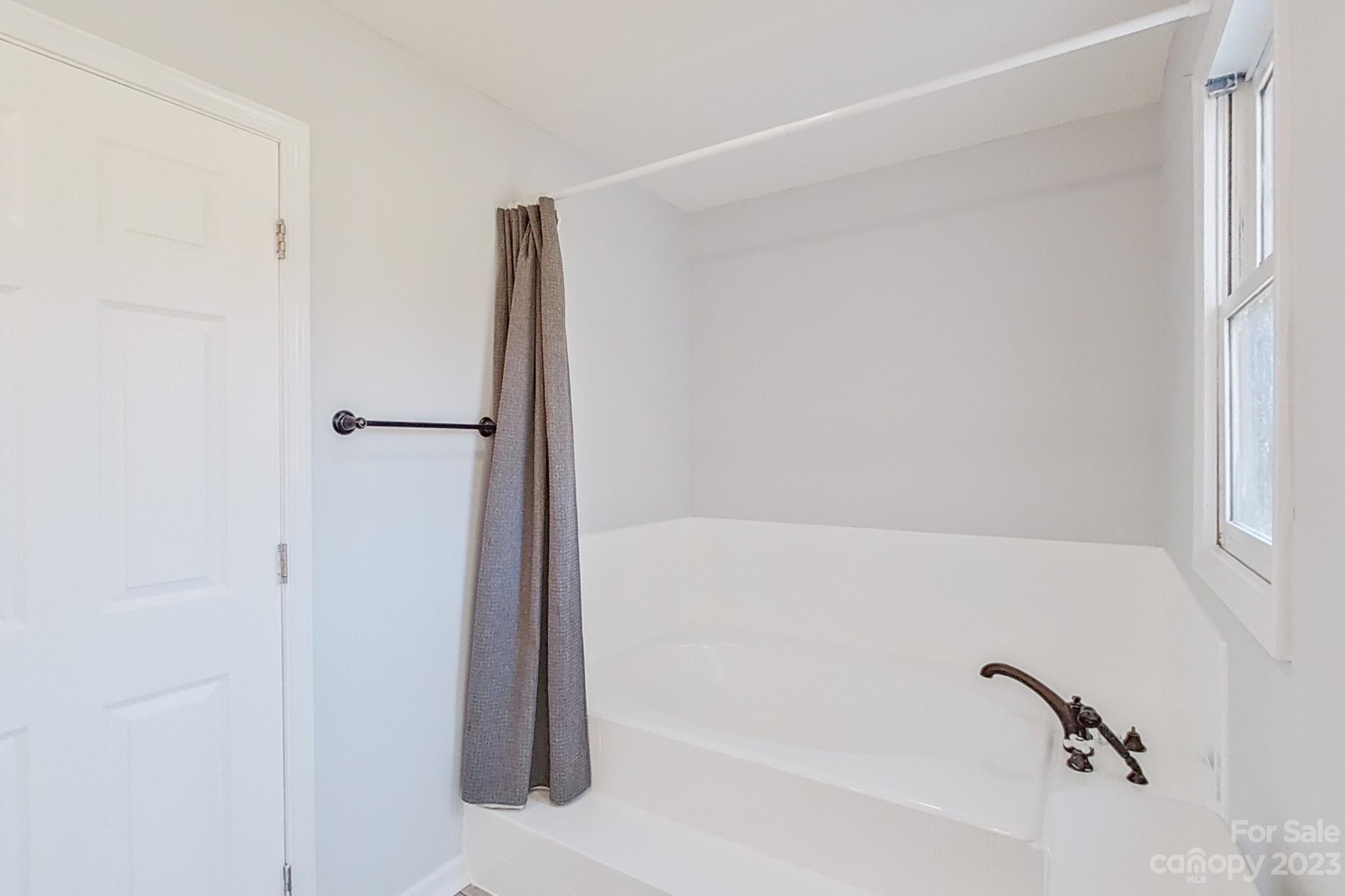 8176 Renee Ford Road Stanfield, NC 28163 - Photo 29 of 48 a bathroom with a bathtub