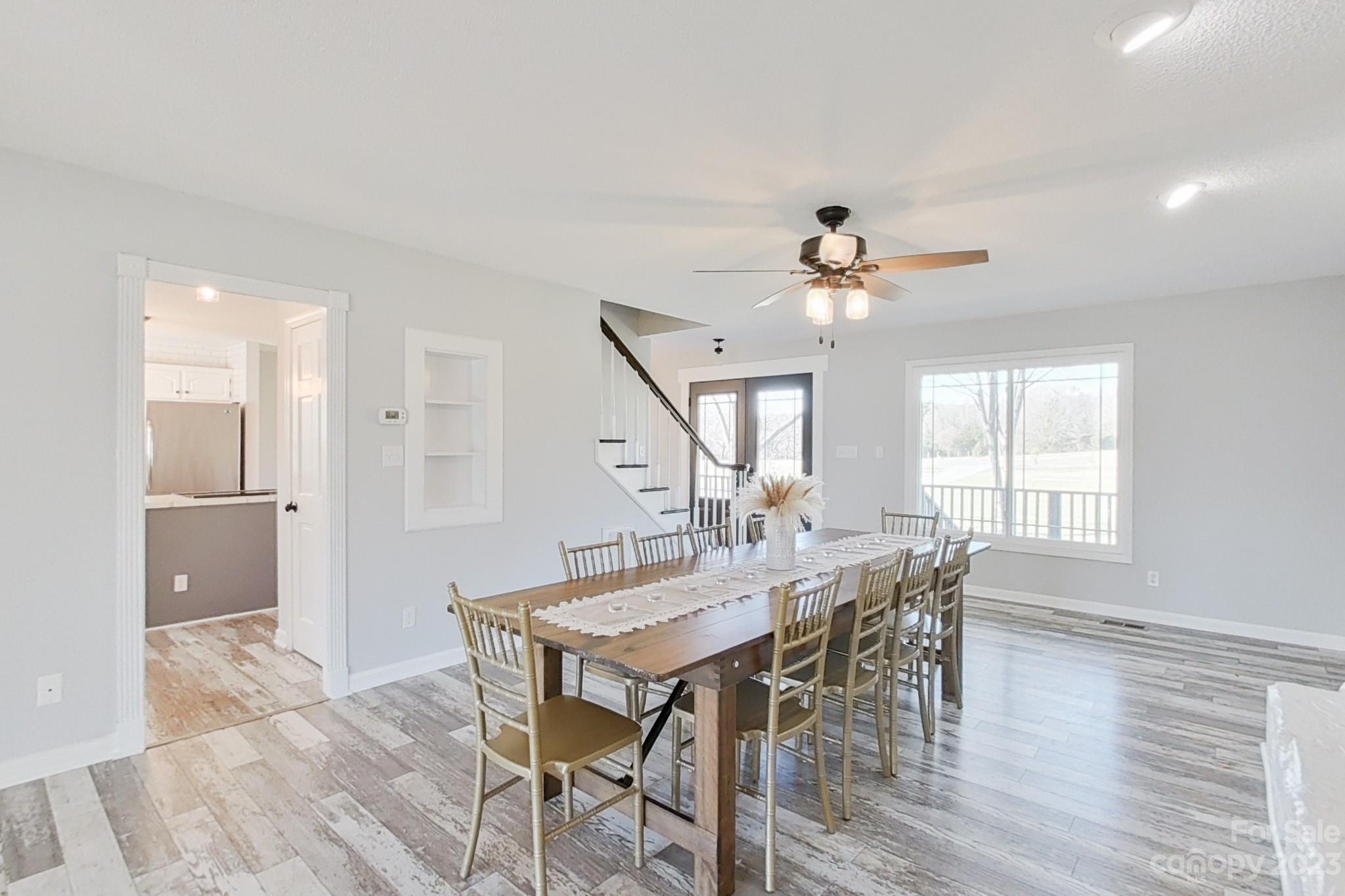 8176 Renee Ford Road Stanfield, NC 28163 - Photo 8 of 48 a view of a a dining room with furniture window and wooden floor