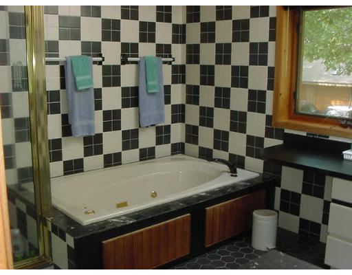 6 Birch Hill Road Pepperell, MA 01463 - Photo 11 of 24 a bathroom with a granite countertop sink a toilet and a shower