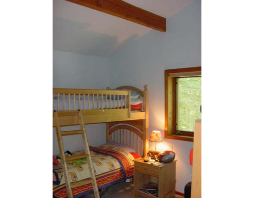 6 Birch Hill Road Pepperell, MA 01463 - Photo 14 of 24 a bedroom with a bed and a window