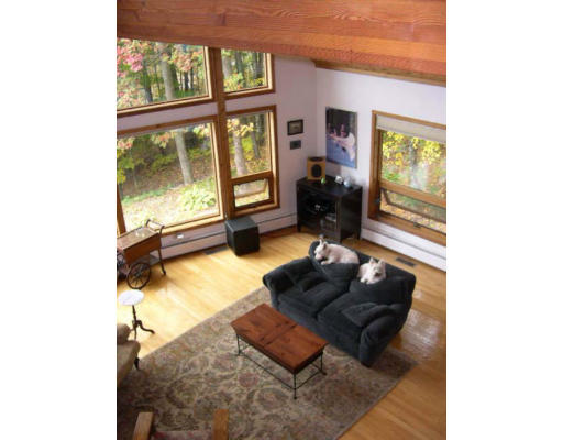 6 Birch Hill Road Pepperell, MA 01463 - Photo 17 of 24 a living room with furniture and a floor to ceiling window