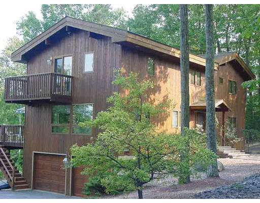 6 Birch Hill Road Pepperell, MA 01463 - Photo 2 of 24 a front view of a house with garden