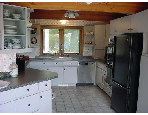 6 Birch Hill Road Pepperell, MA 01463 - Photo 8 of 24 a kitchen with stainless steel appliances granite countertop a refrigerator sink and stove