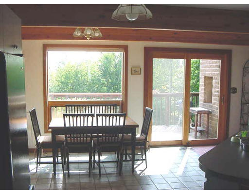 6 Birch Hill Road Pepperell, MA 01463 - Photo 9 of 24 a view of a dining room with furniture wooden floor and a potted plant