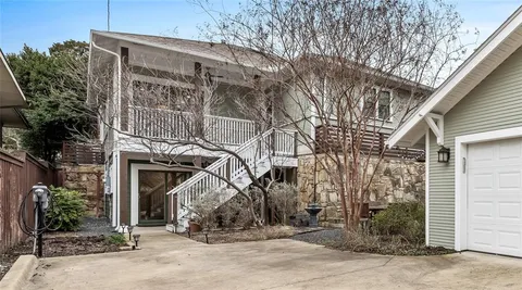 a view of a house with a tree