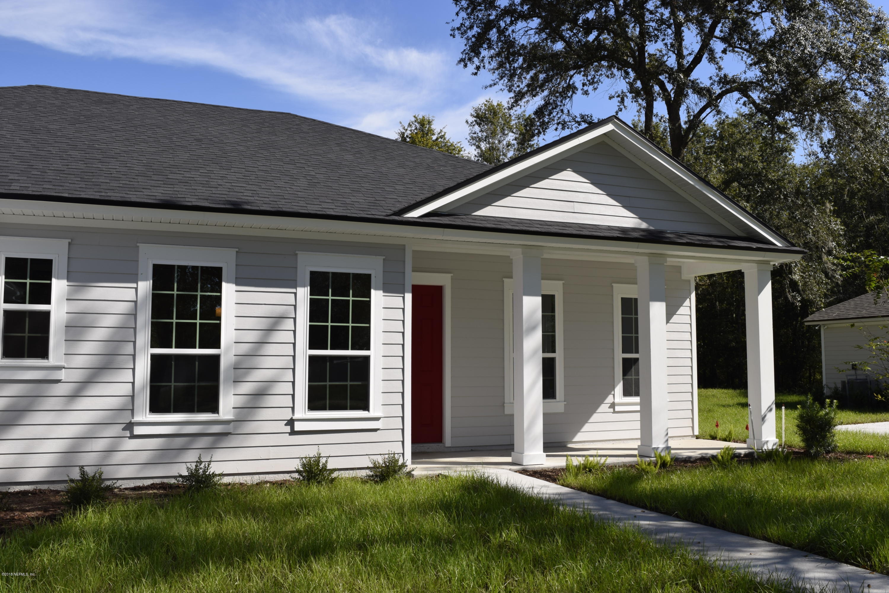 4046 Old Jennings Road Middleburg, FL 32068 - Photo 32 of 46 a front view of a house with a yard