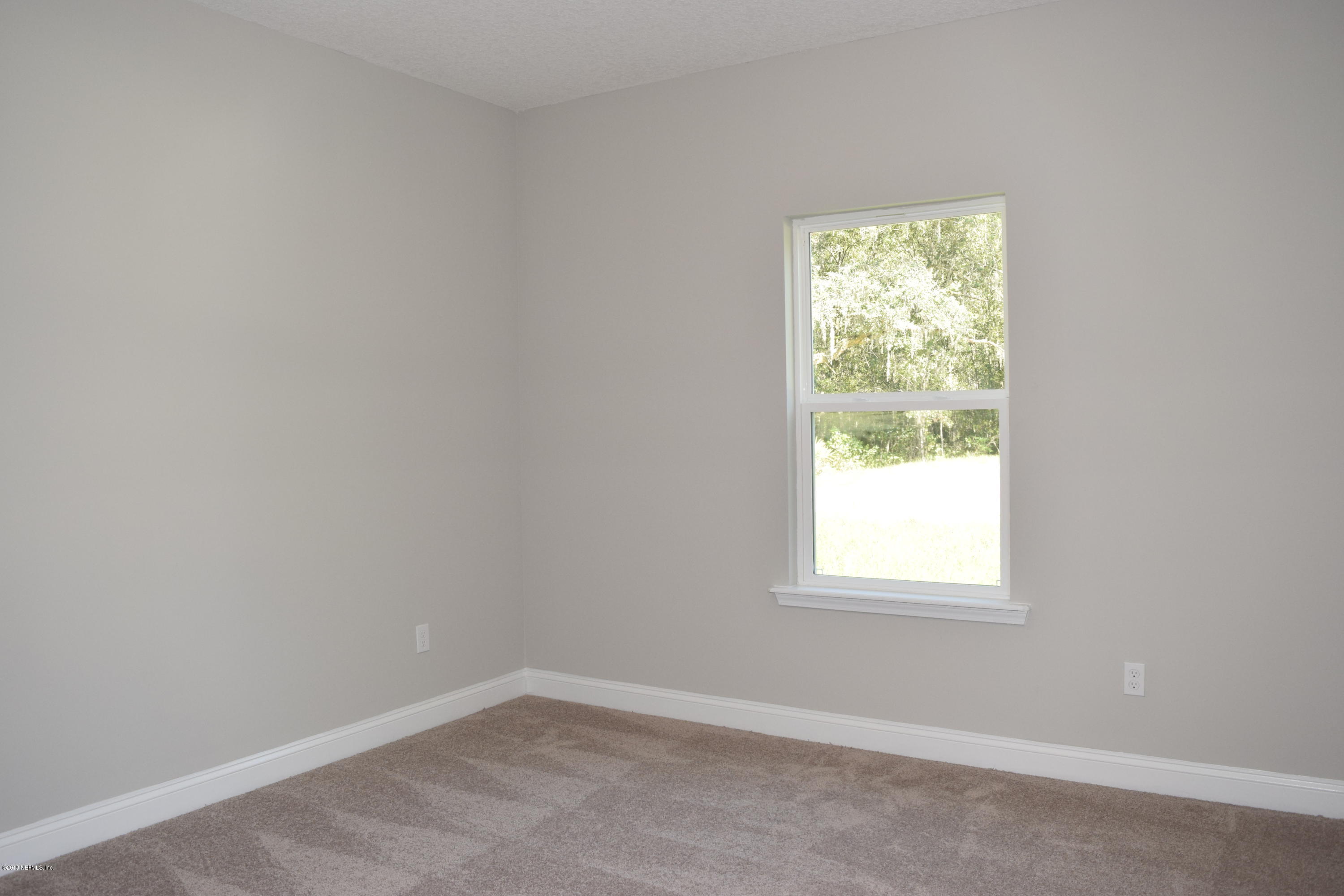 4046 Old Jennings Road Middleburg, FL 32068 - Photo 41 of 46 an empty room with a window