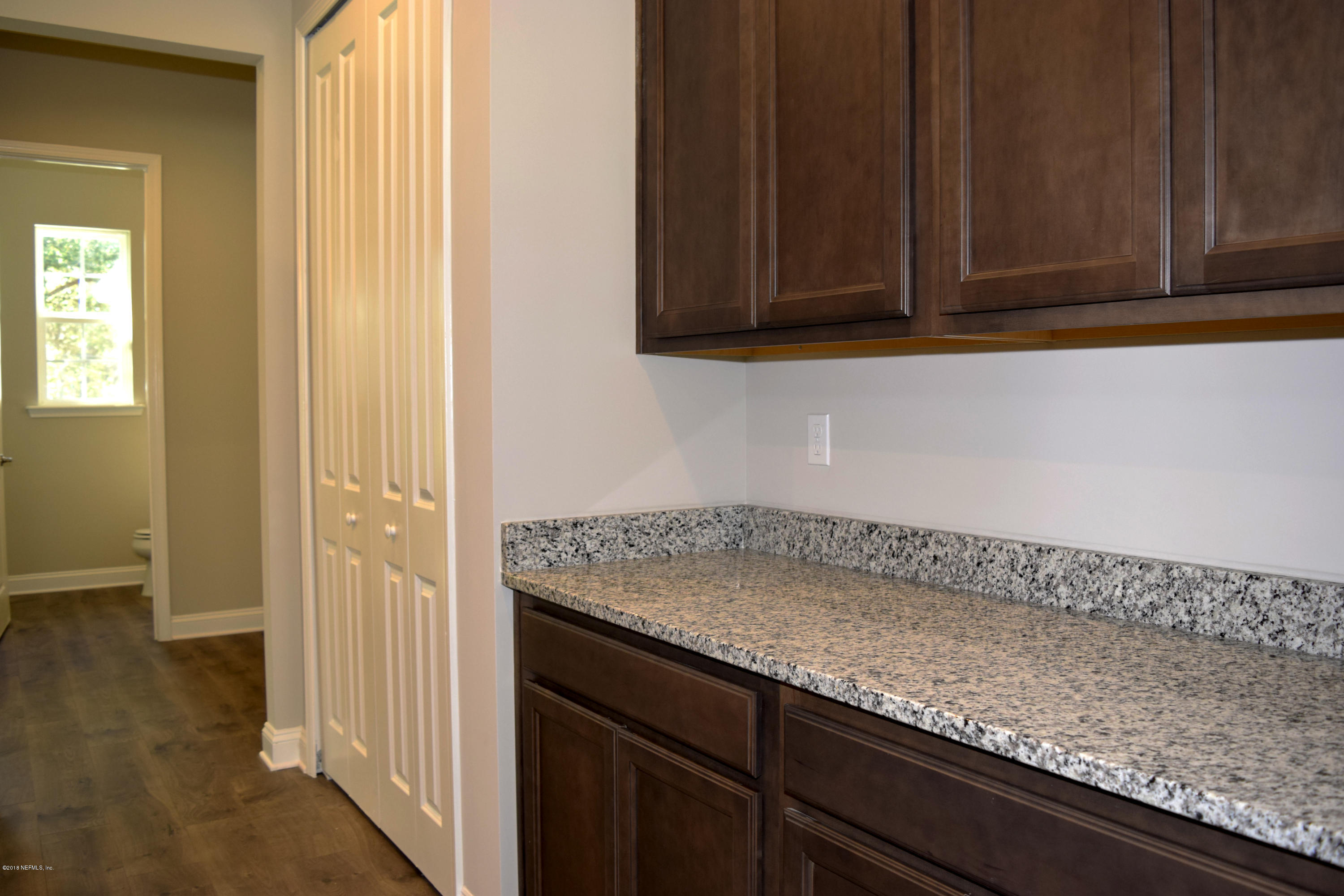 4046 Old Jennings Road Middleburg, FL 32068 - Photo 8 of 46 a view white cabinets and a wooden floor