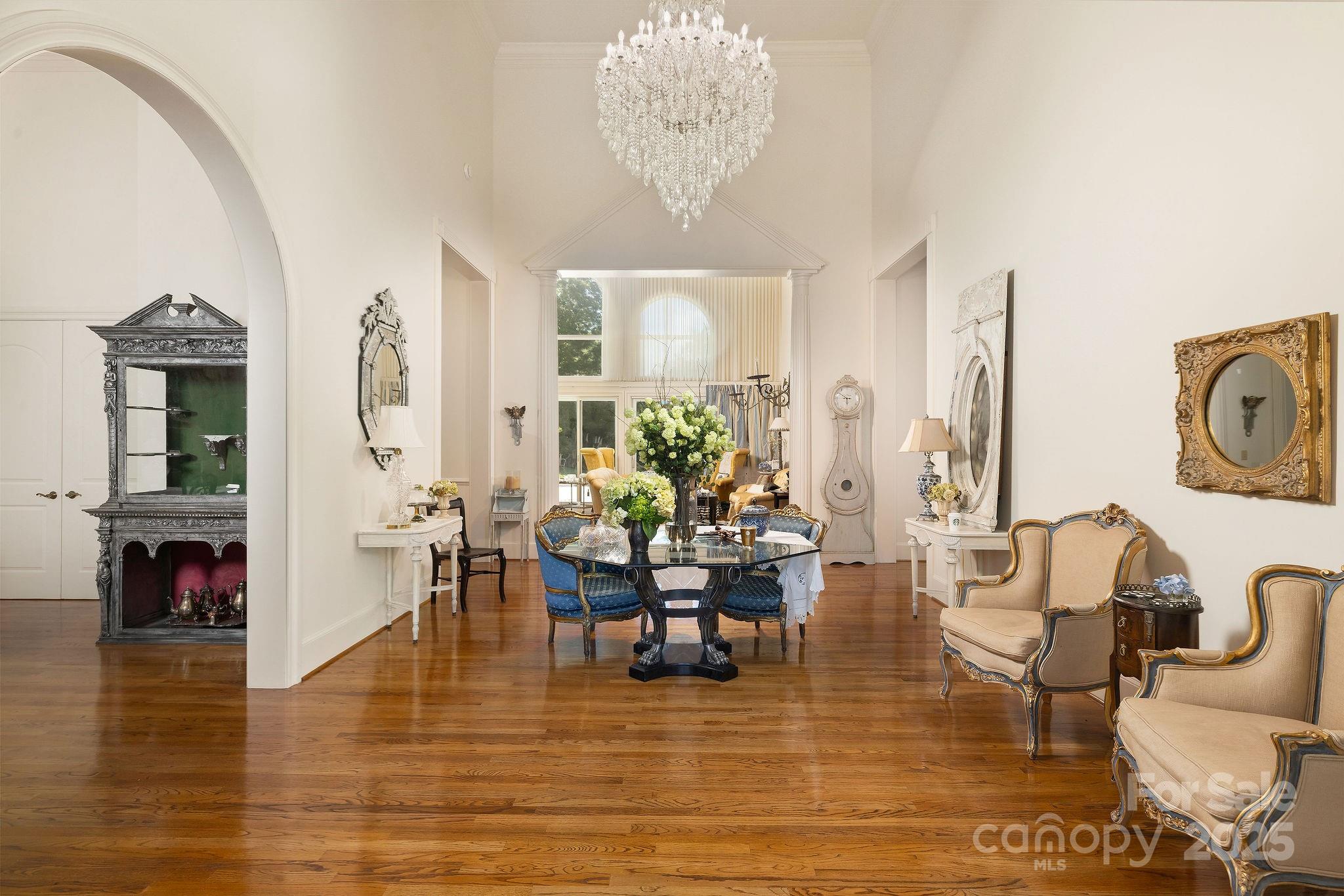 282 Hamilton Drive Columbus, NC 28722 - Photo 13 of 46 a living room with fireplace furniture and a chandelier