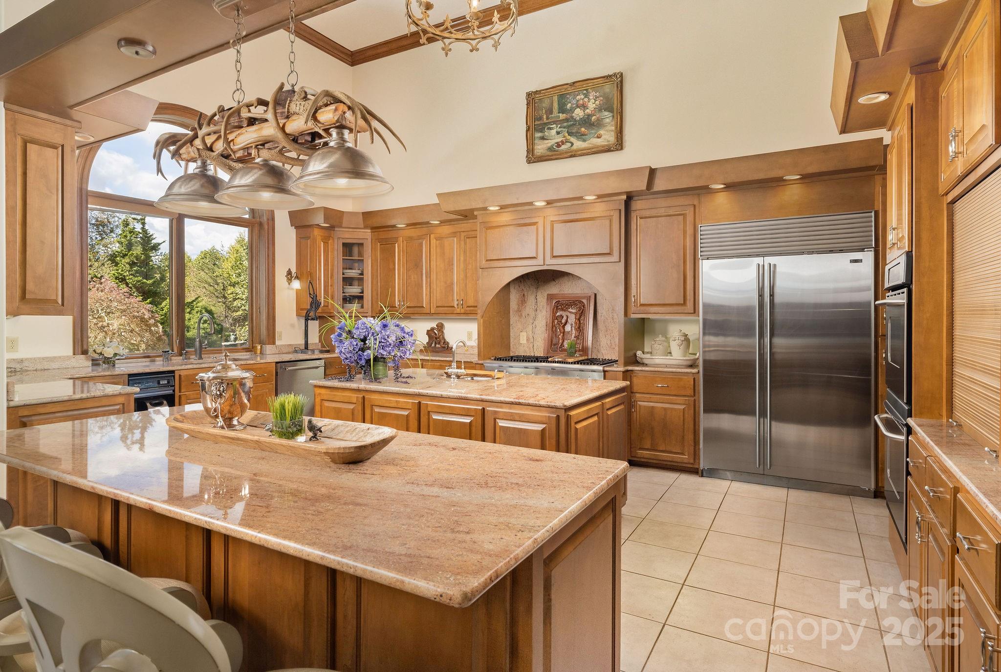 282 Hamilton Drive Columbus, NC 28722 - Photo 16 of 46 a kitchen with kitchen island granite countertop a sink a counter top space appliances and cabinets