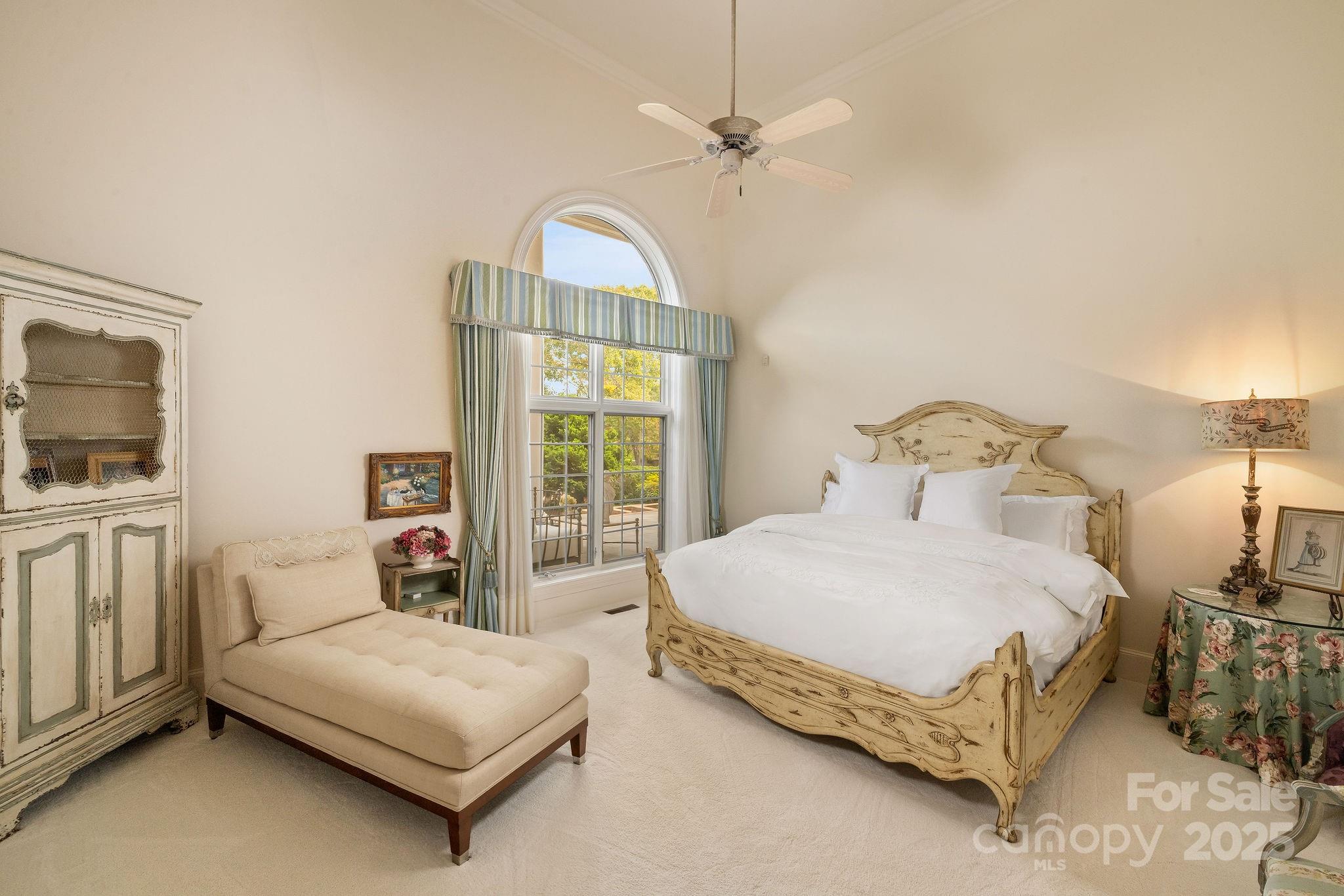 282 Hamilton Drive Columbus, NC 28722 - Photo 26 of 46 a bedroom with a bed a window and couch