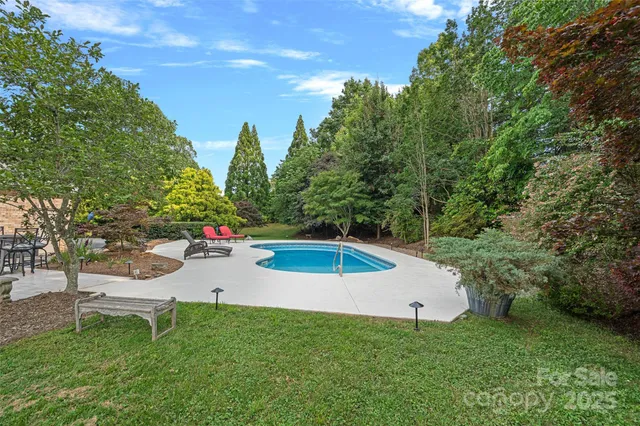 a view of a backyard with sitting area