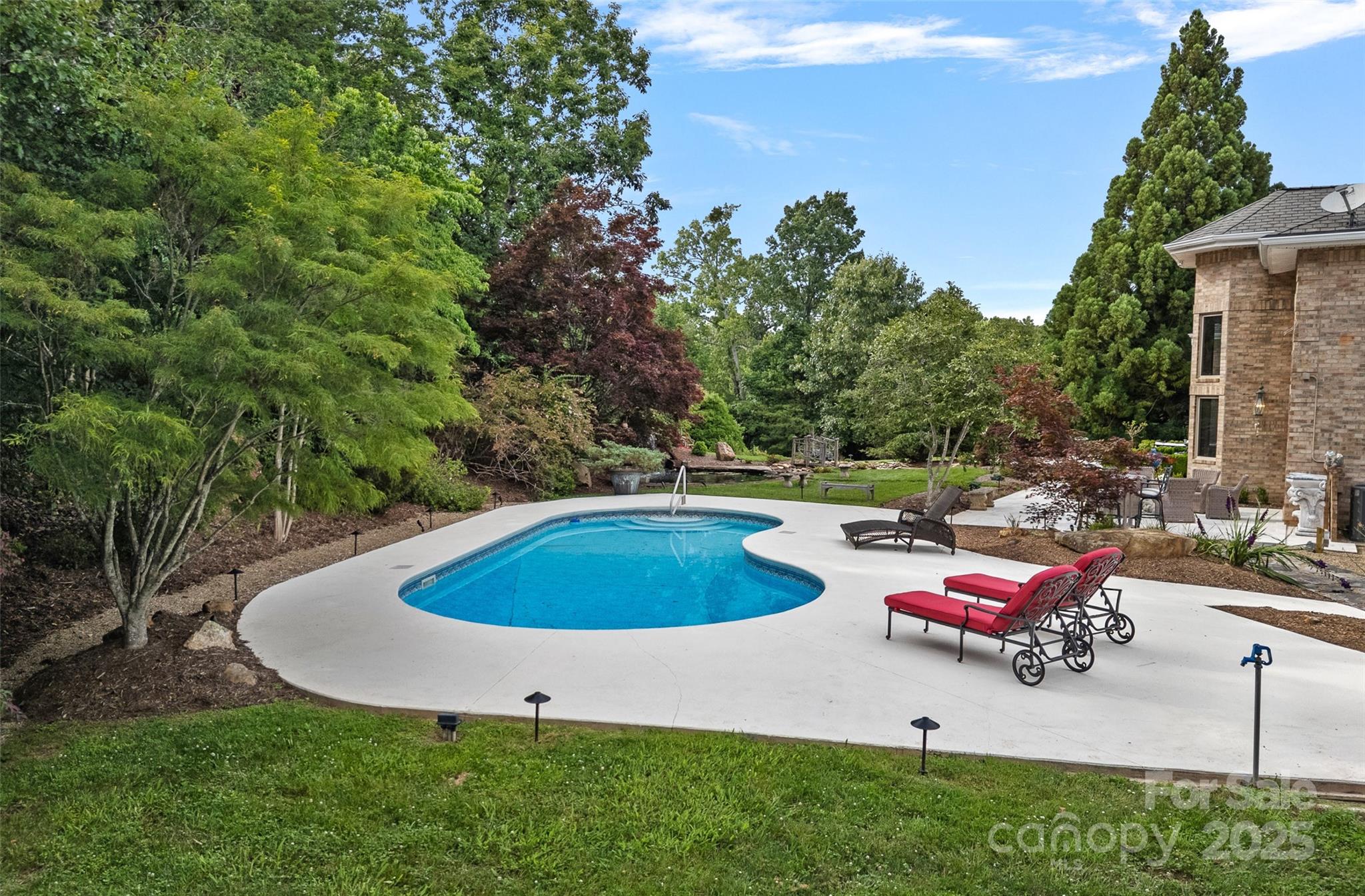 282 Hamilton Drive Columbus, NC 28722 - Photo 34 of 46 a view of a backyard with swimming pool