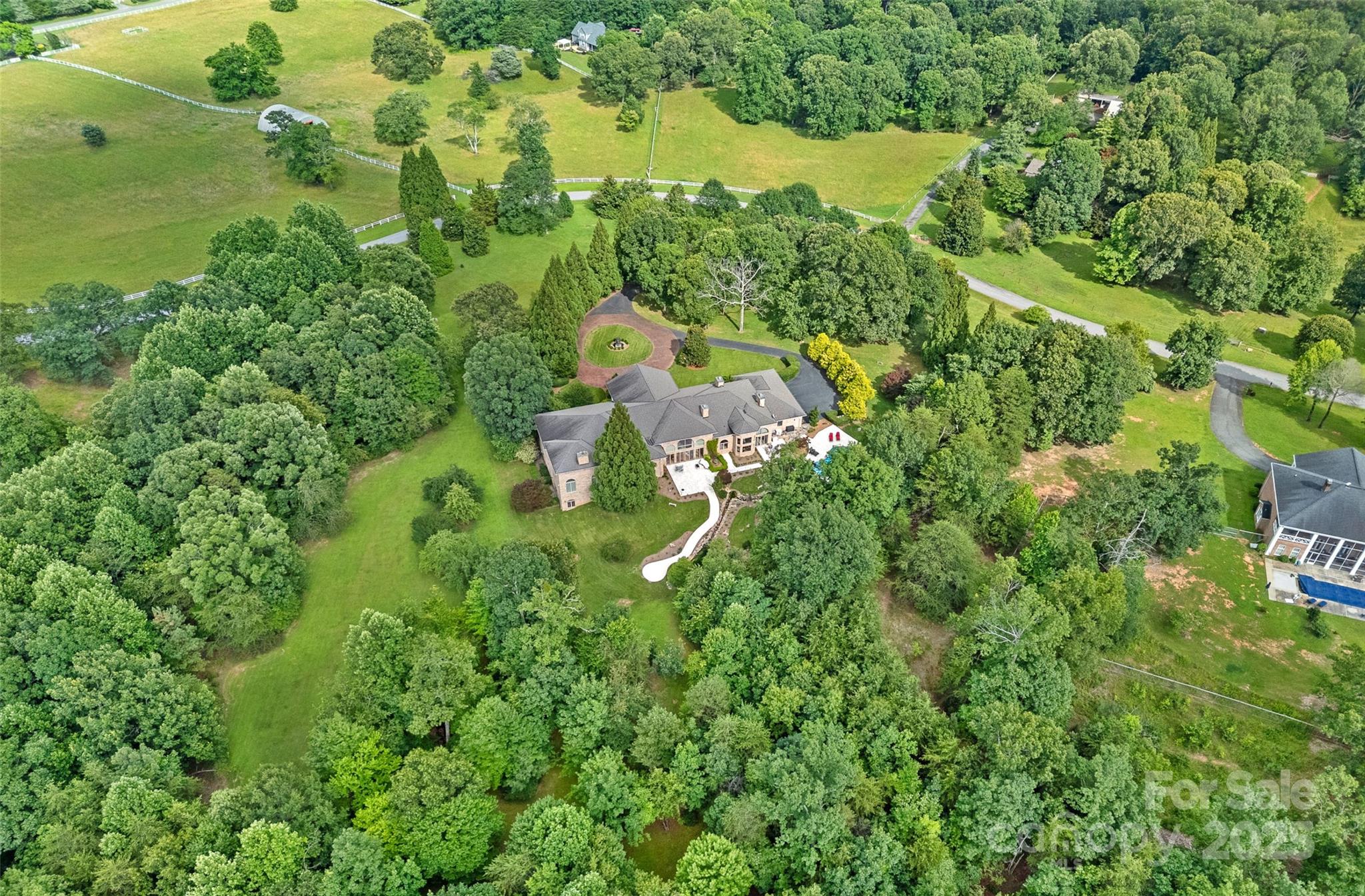 282 Hamilton Drive Columbus, NC 28722 - Photo 46 of 46 an aerial view of residential houses with outdoor space and trees all around