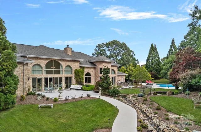 a front view of a house with a yard table and chairs