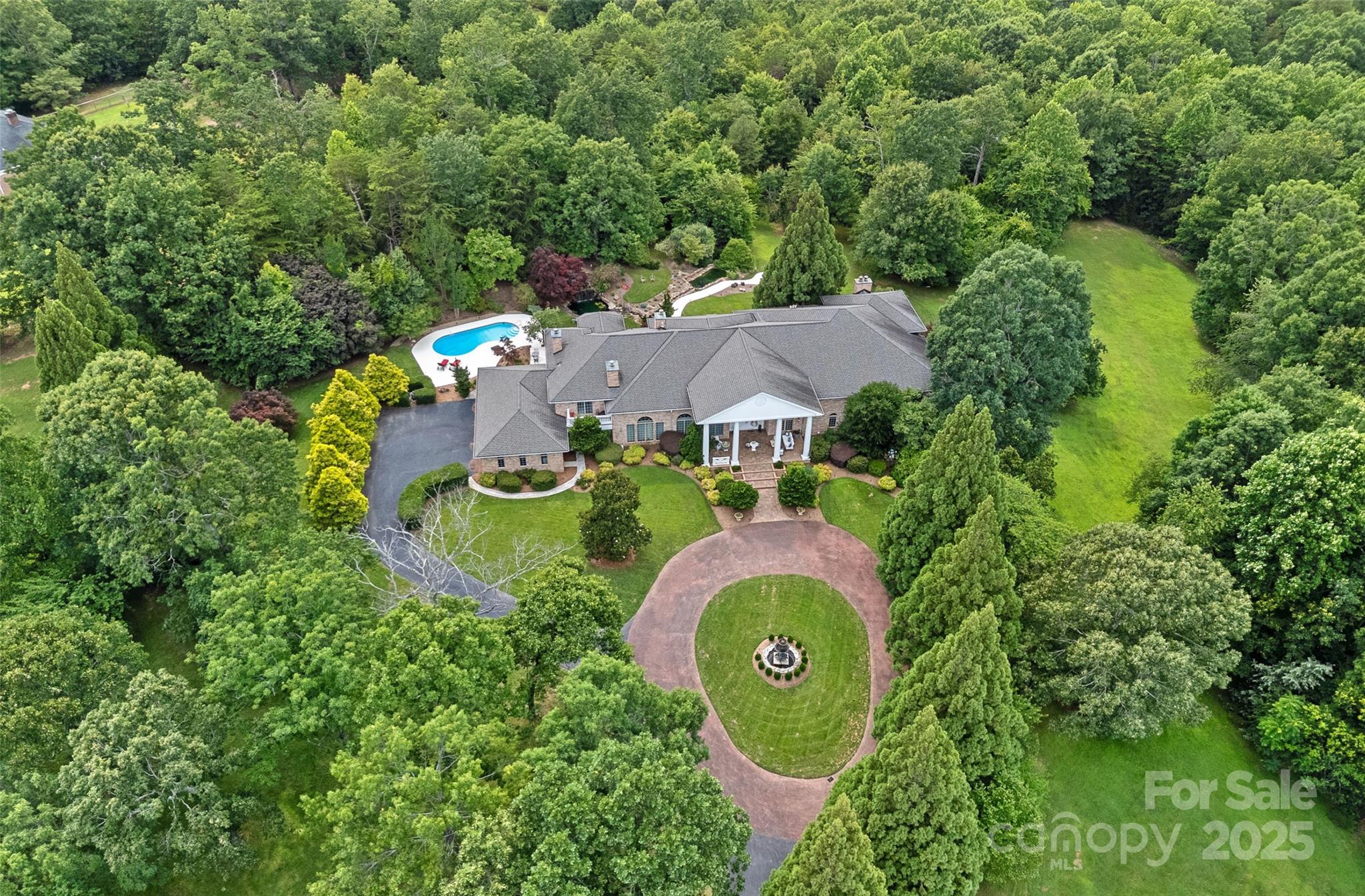 282 Hamilton Drive Columbus, NC 28722 - Photo 7 of 46 an aerial view of a house with a swimming pool