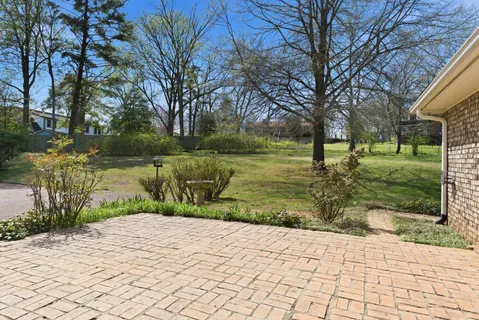 a view of a lake with a yard