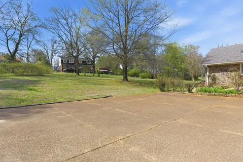 a view of a road with a building in the background