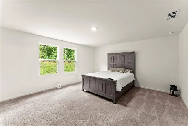 a room with a bed and a window