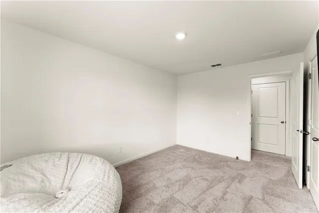 a view of a room with a bed and closet