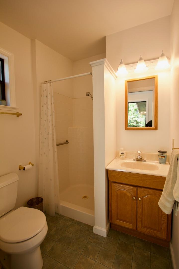 211 Modoc Place Pacifica, CA 94044 - Photo 11 of 25 a bathroom with a toilet sink and mirror