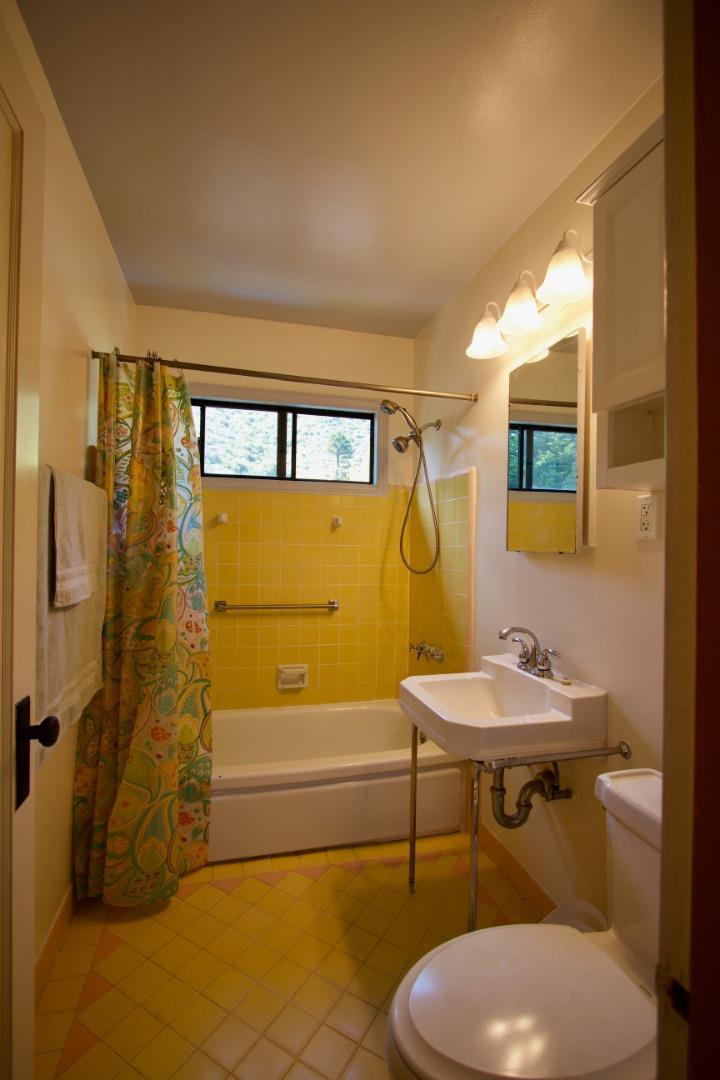 211 Modoc Place Pacifica, CA 94044 - Photo 14 of 25 a bathroom with a sink mirror vanity and toilet