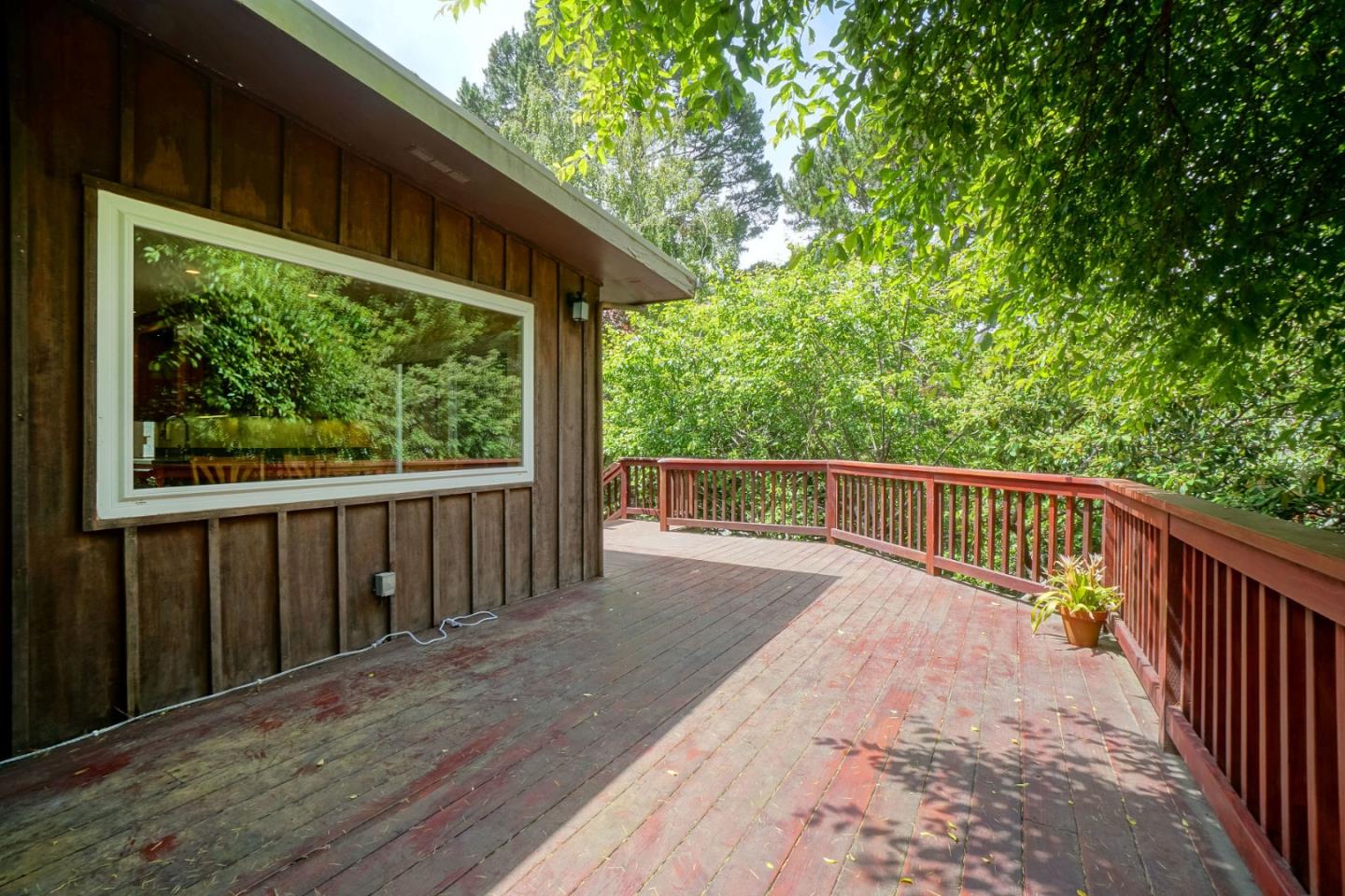 211 Modoc Place Pacifica, CA 94044 - Photo 15 of 25 a balcony with wooden floor and yard in the back