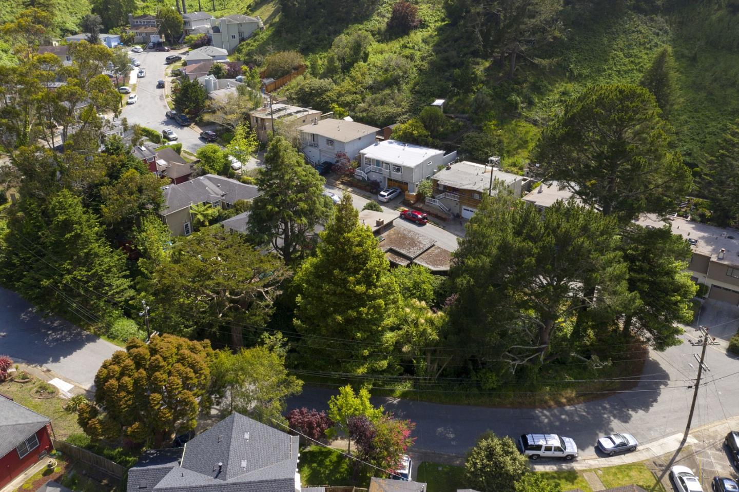211 Modoc Place Pacifica, CA 94044 - Photo 20 of 25 an aerial view of residential house with outdoor space and trees all around