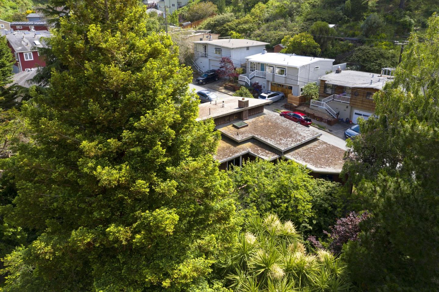 211 Modoc Place Pacifica, CA 94044 - Photo 21 of 25 a view of a patio with table and chairs and potted plants