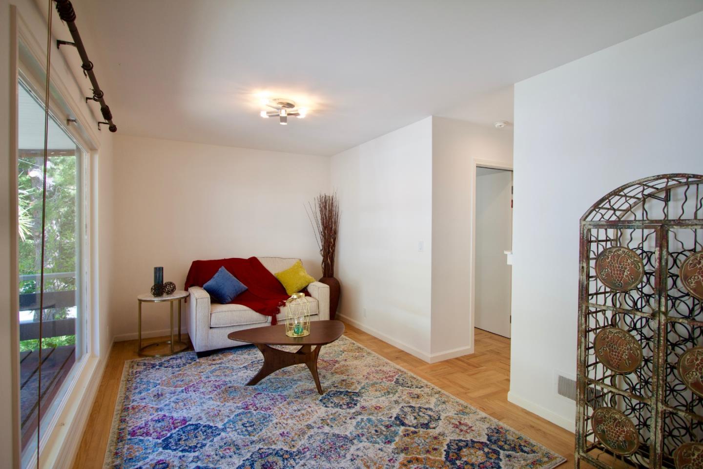 211 Modoc Place Pacifica, CA 94044 - Photo 3 of 25 a living room with furniture and a rug