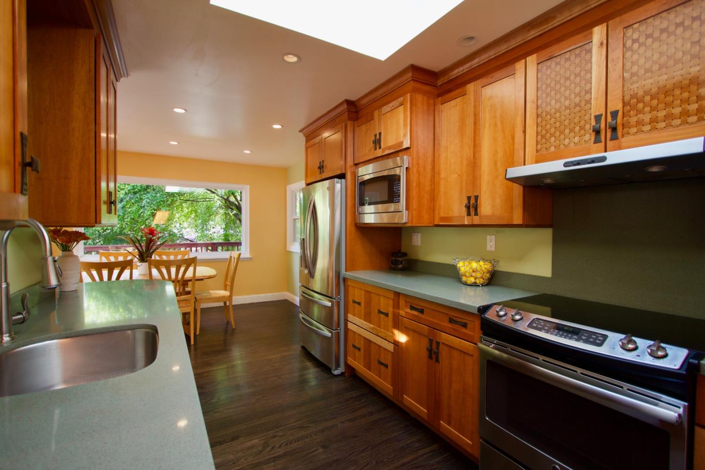 211 Modoc Place Pacifica, CA 94044 - Photo 4 of 25 a kitchen with stainless steel appliances granite countertop a stove and a sink
