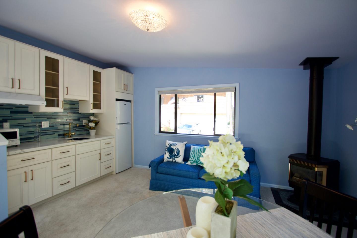 211 Modoc Place Pacifica, CA 94044 - Photo 8 of 25 a living room with furniture flowerpot and a window
