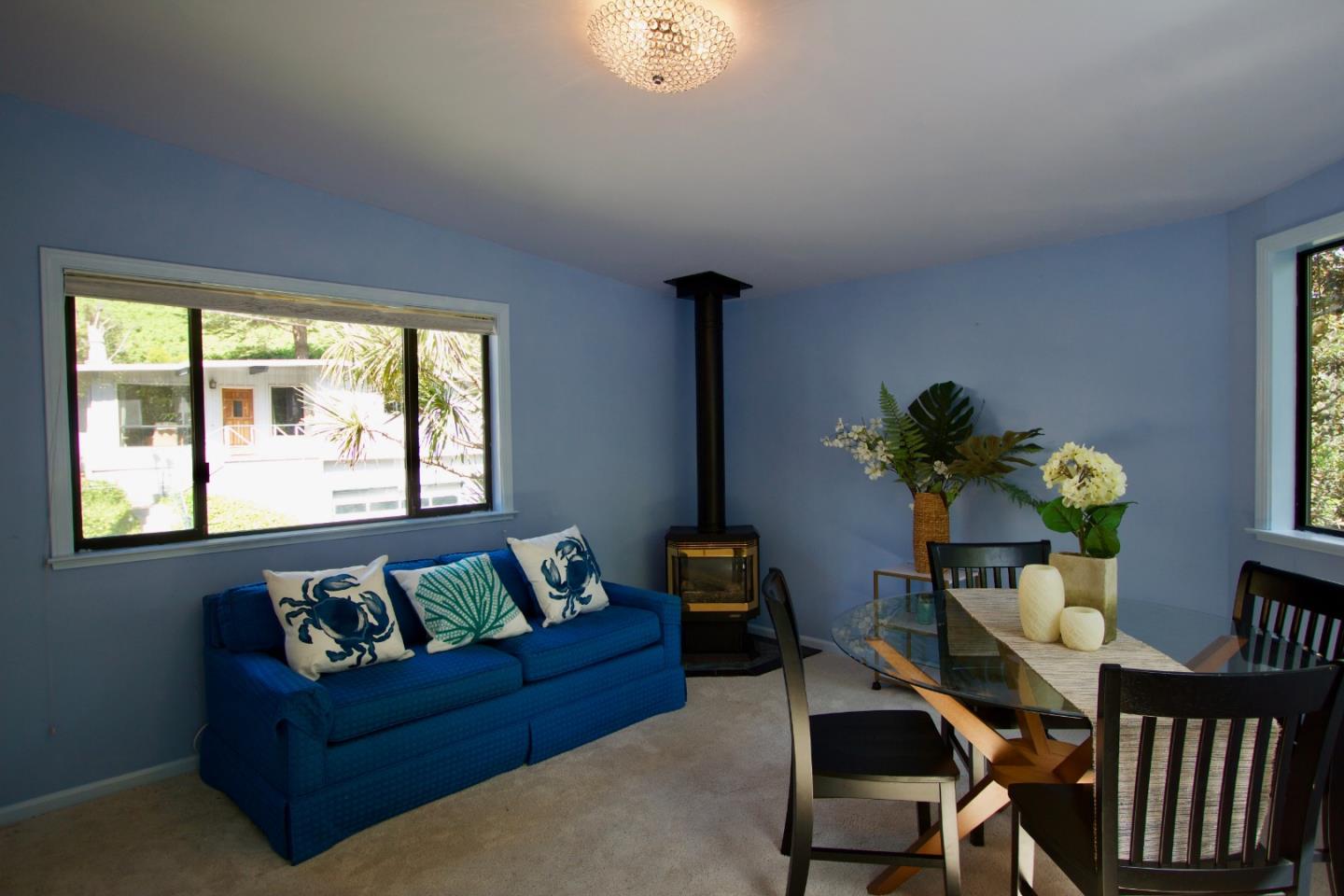 211 Modoc Place Pacifica, CA 94044 - Photo 9 of 25 a living room with furniture flowerpot and a window