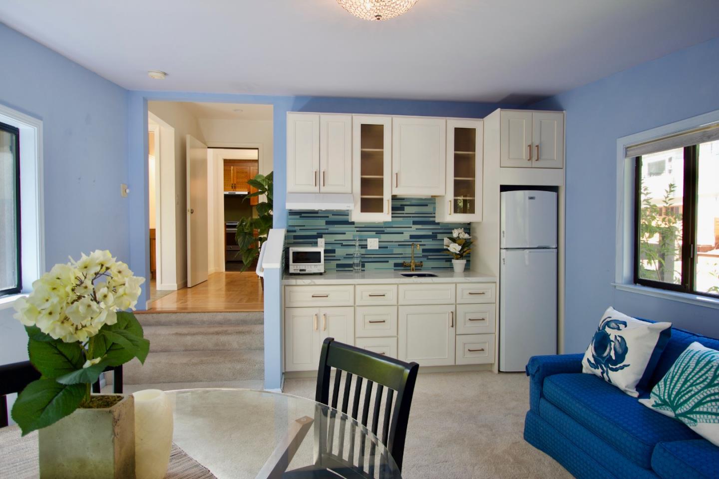 211 Modoc Place Pacifica, CA 94044 - Photo 10 of 25 a living room with stainless steel appliances kitchen island granite countertop furniture and a fireplace