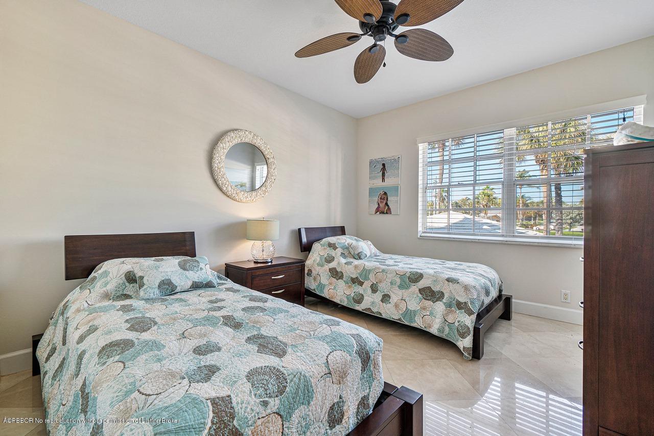 5900 Old Ocean Boulevard, Unit B1 Ocean Ridge, FL 33435 - Photo 17 of 26 a bedroom with two large bed and a window
