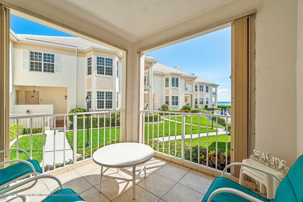 5900 Old Ocean Boulevard, Unit B1 Ocean Ridge, FL 33435 - Photo 3 of 26 a living room with furniture and a floor to ceiling window