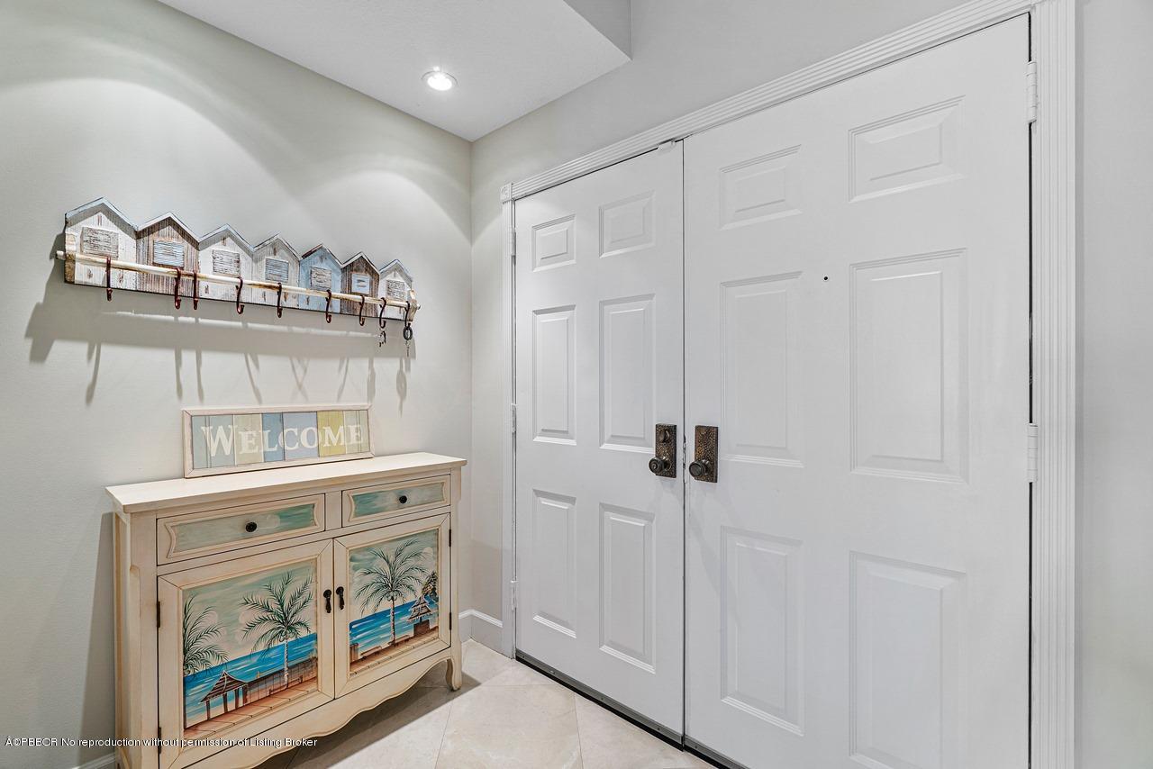 5900 Old Ocean Boulevard, Unit B1 Ocean Ridge, FL 33435 - Photo 4 of 26 a view of hallway with washer and dryer
