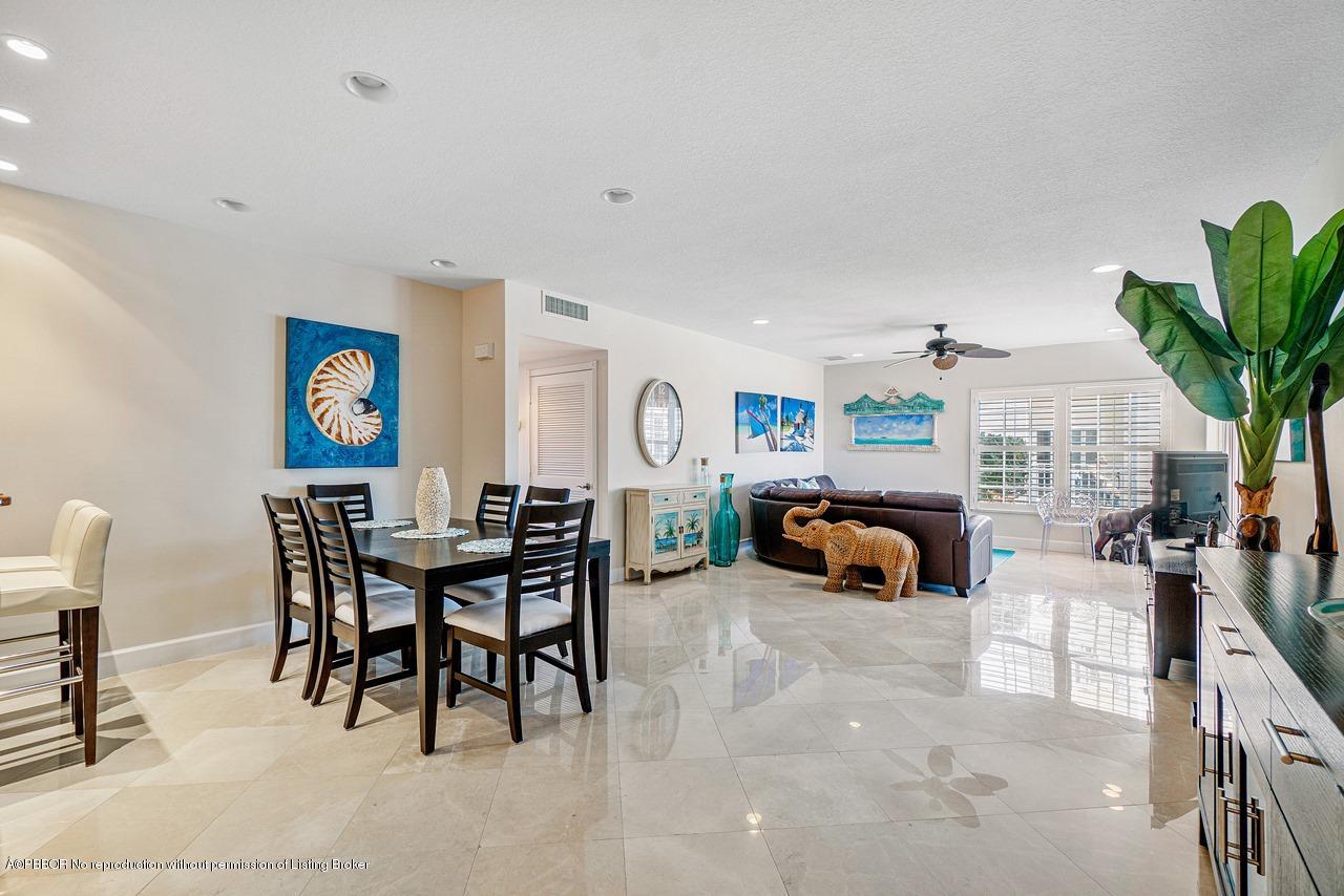 5900 Old Ocean Boulevard, Unit B1 Ocean Ridge, FL 33435 - Photo 5 of 26 a living room with furniture and a fireplace